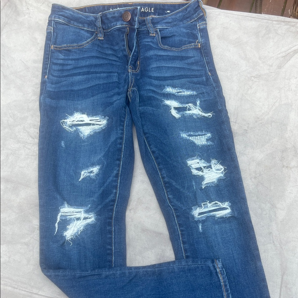 American Eagle Outfitters Women's Ripped Dark Blue Skinny Jeans.